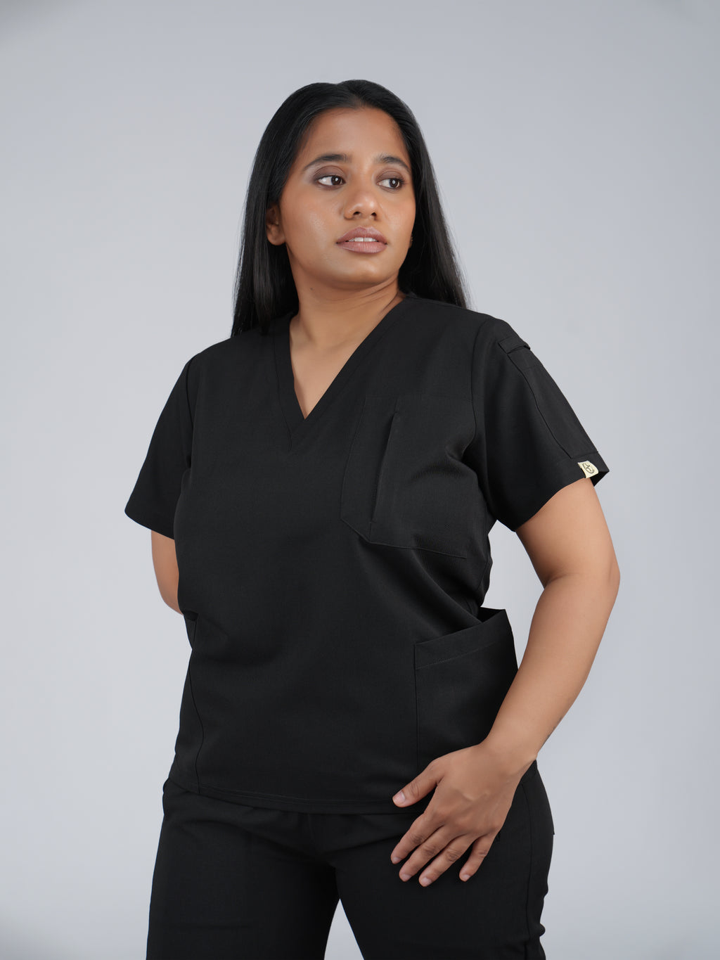 Edg premium scrub top for doctors - Black Magic - three-quarter side pocket view