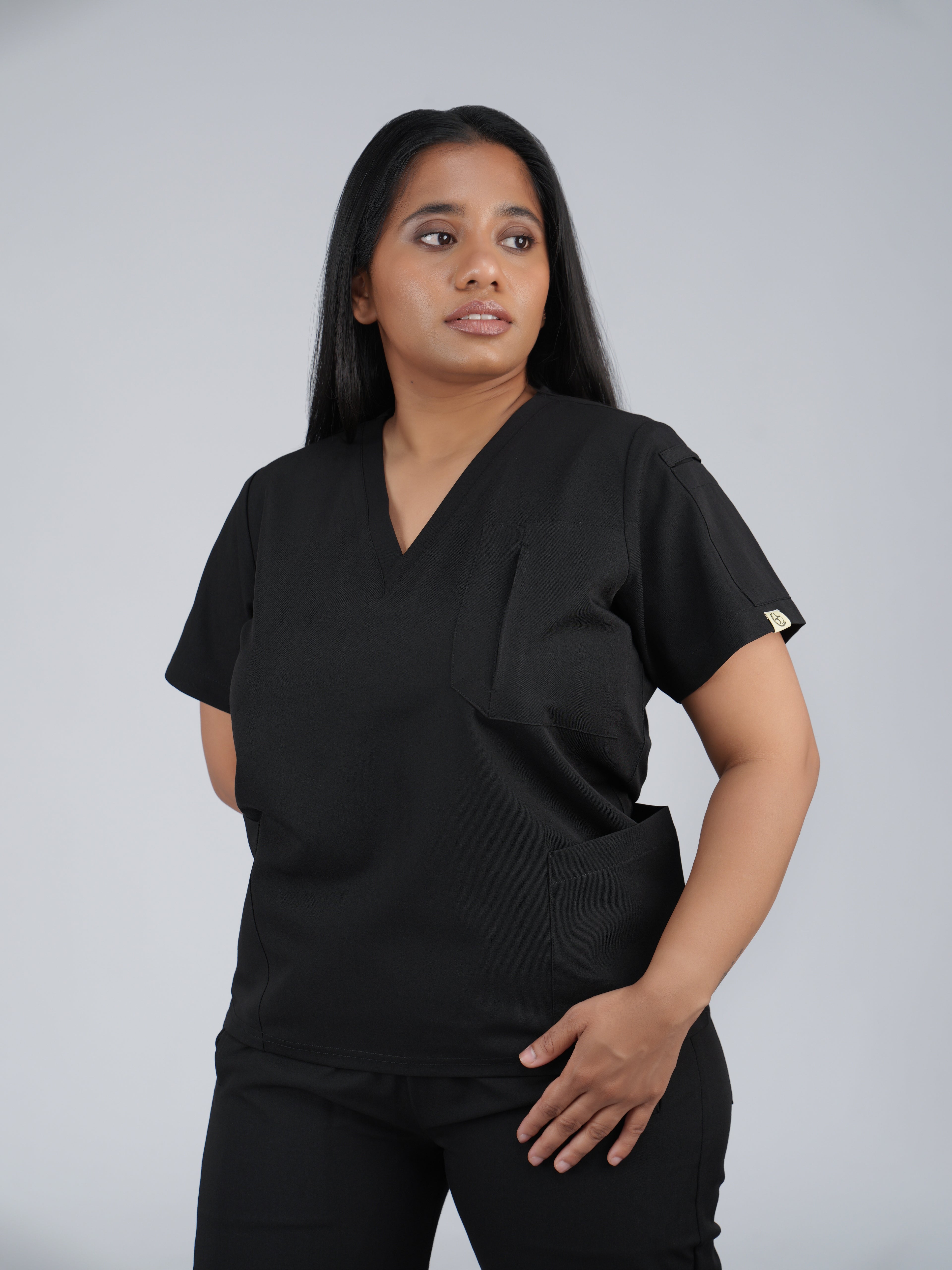 Edg premium scrub top for doctors - Black Magic - three-quarter side pocket view