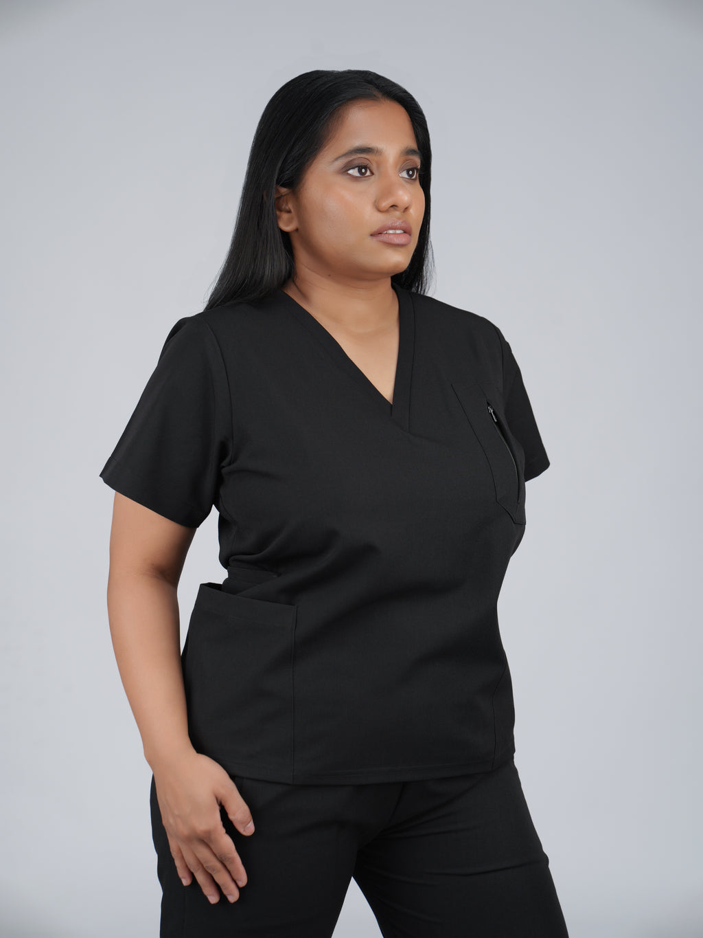 Edg premium scrub top for doctors - Black Magic - worn on model - side pocket