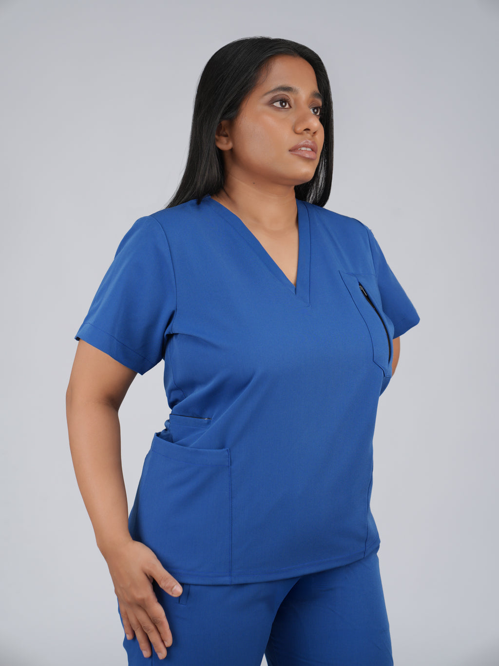 Edg premium scrub top for doctors - Blue Horse - worn on model - side pocket