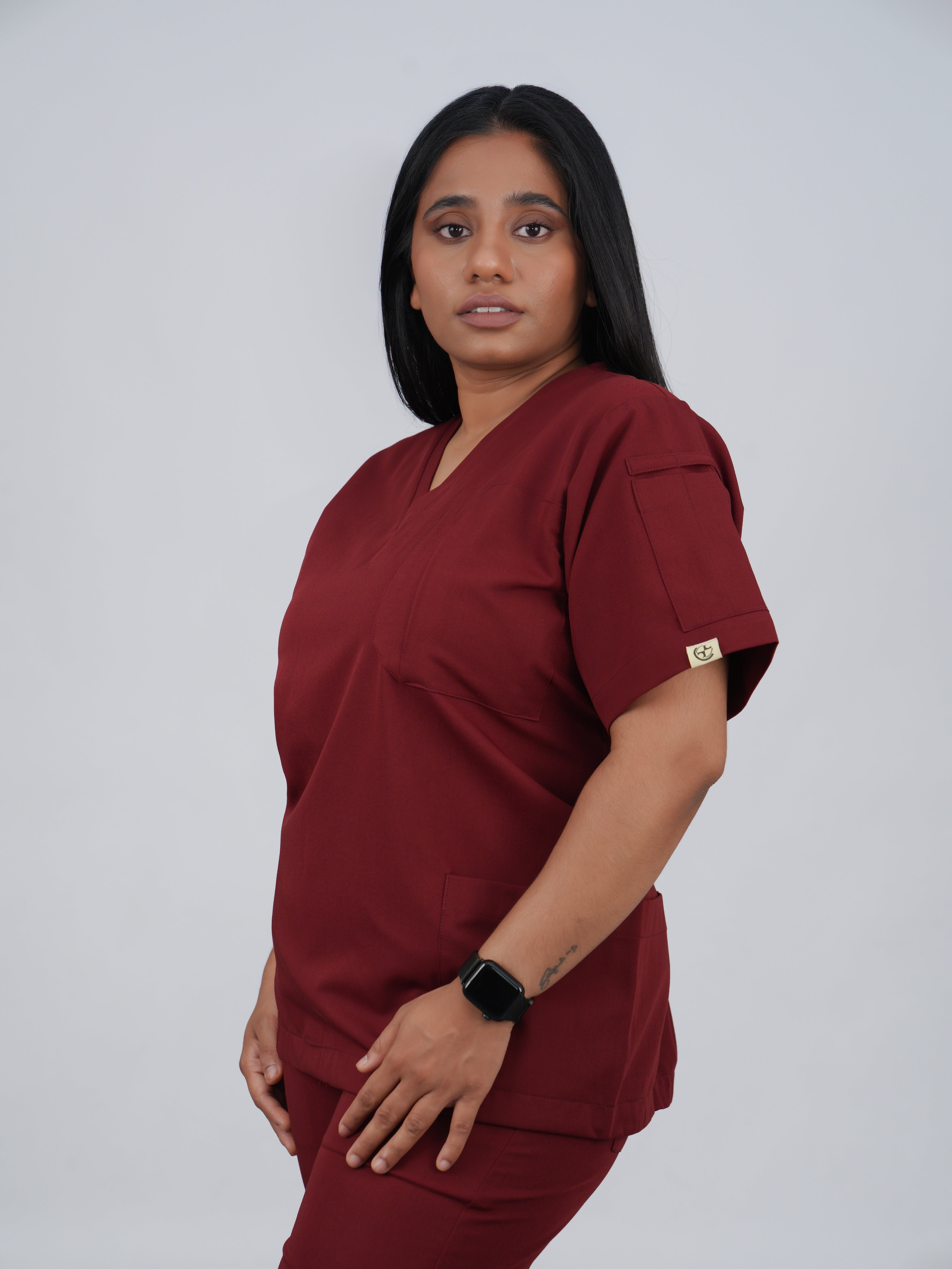 Edg premium scrub top for doctors - Cherry Jam - three-quarter side pocket view