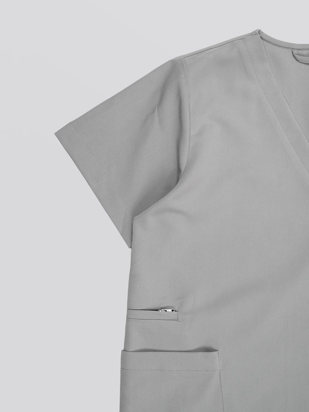 Edg premium scrub top for doctors - Pigeon Ash - three-quarter side pocket view