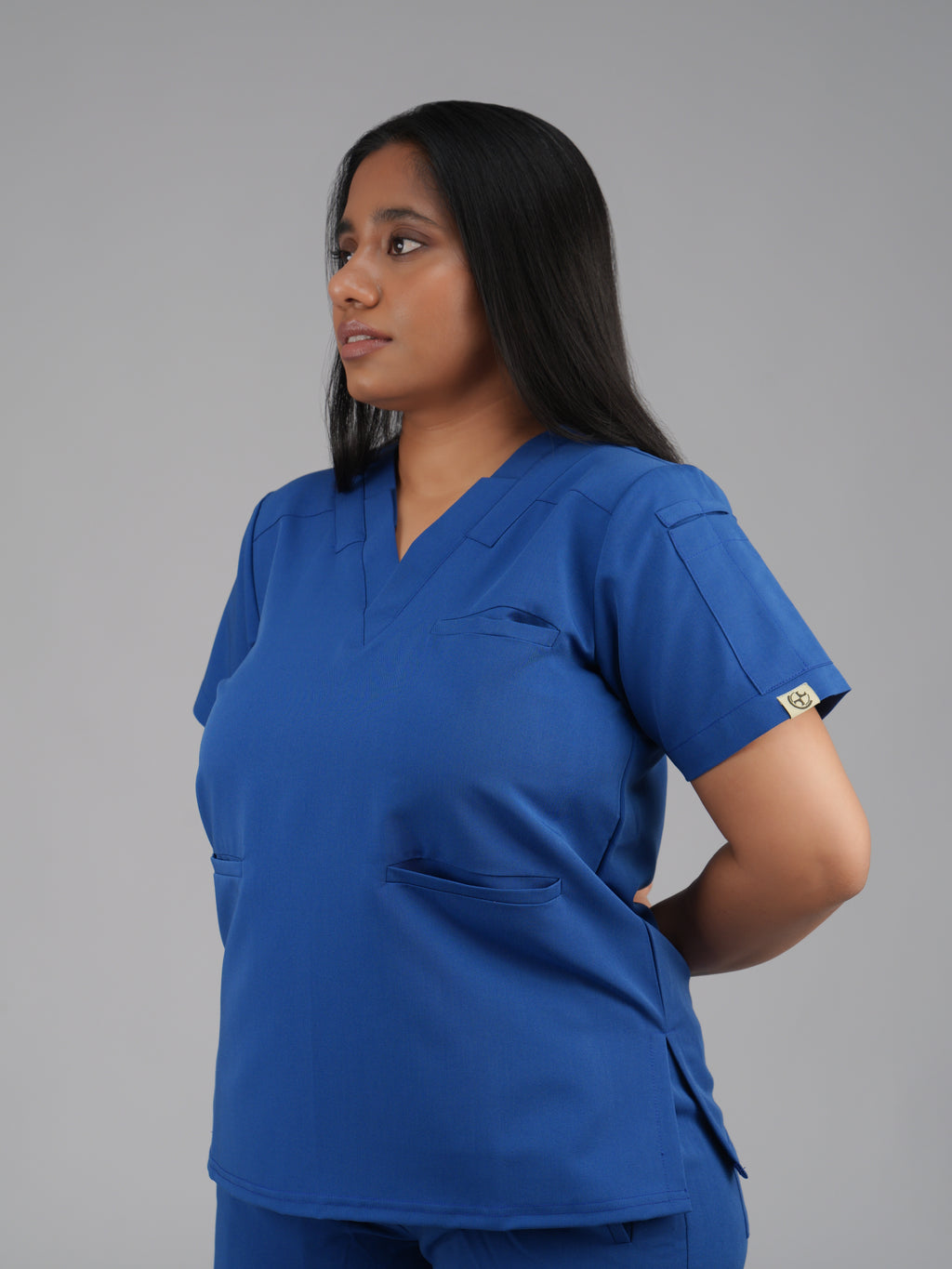 Splet premium scrub top for doctors - Blue Horse- three-quarter side view