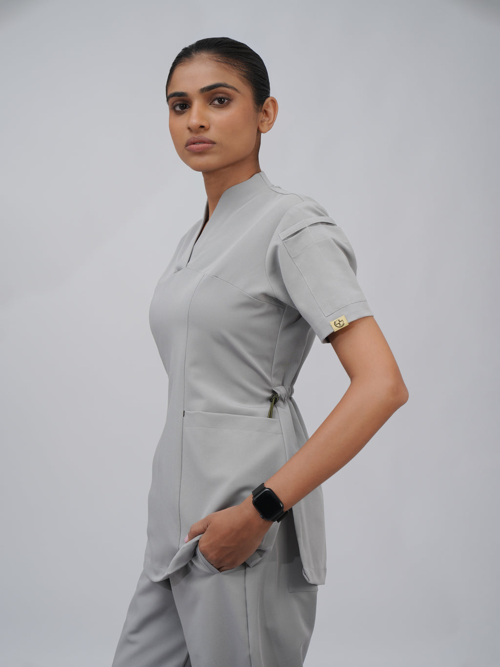 Sqwish premium scrub top for doctors - Pigeon Ash - three-quarter side view
