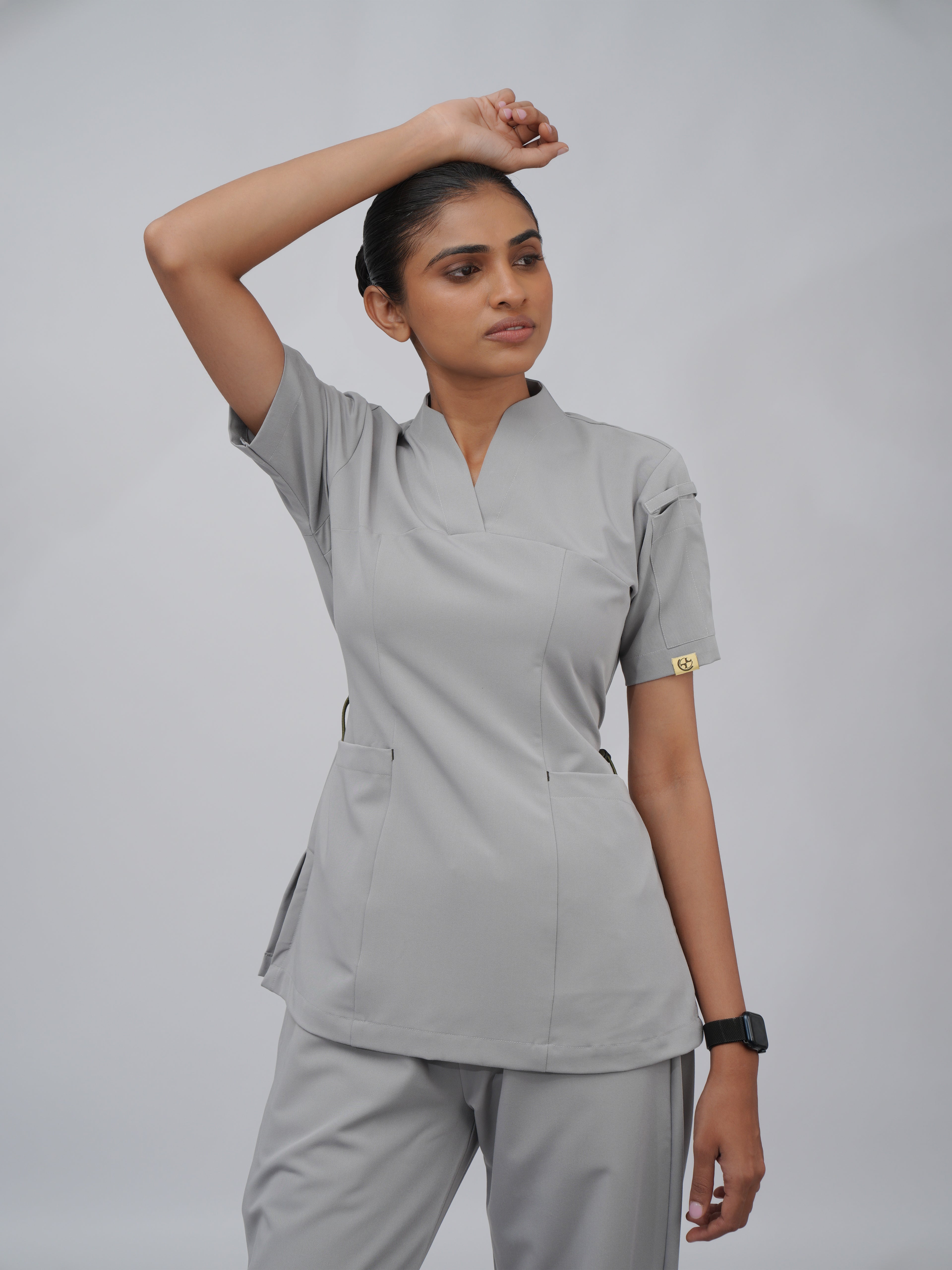 Sqwish premium scrub top for doctors - Pigeon Ash - worn on model