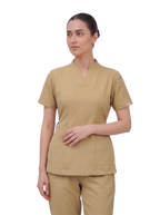 Sqwish premium scrub top for doctors - Sand Skin - three-quarter side 