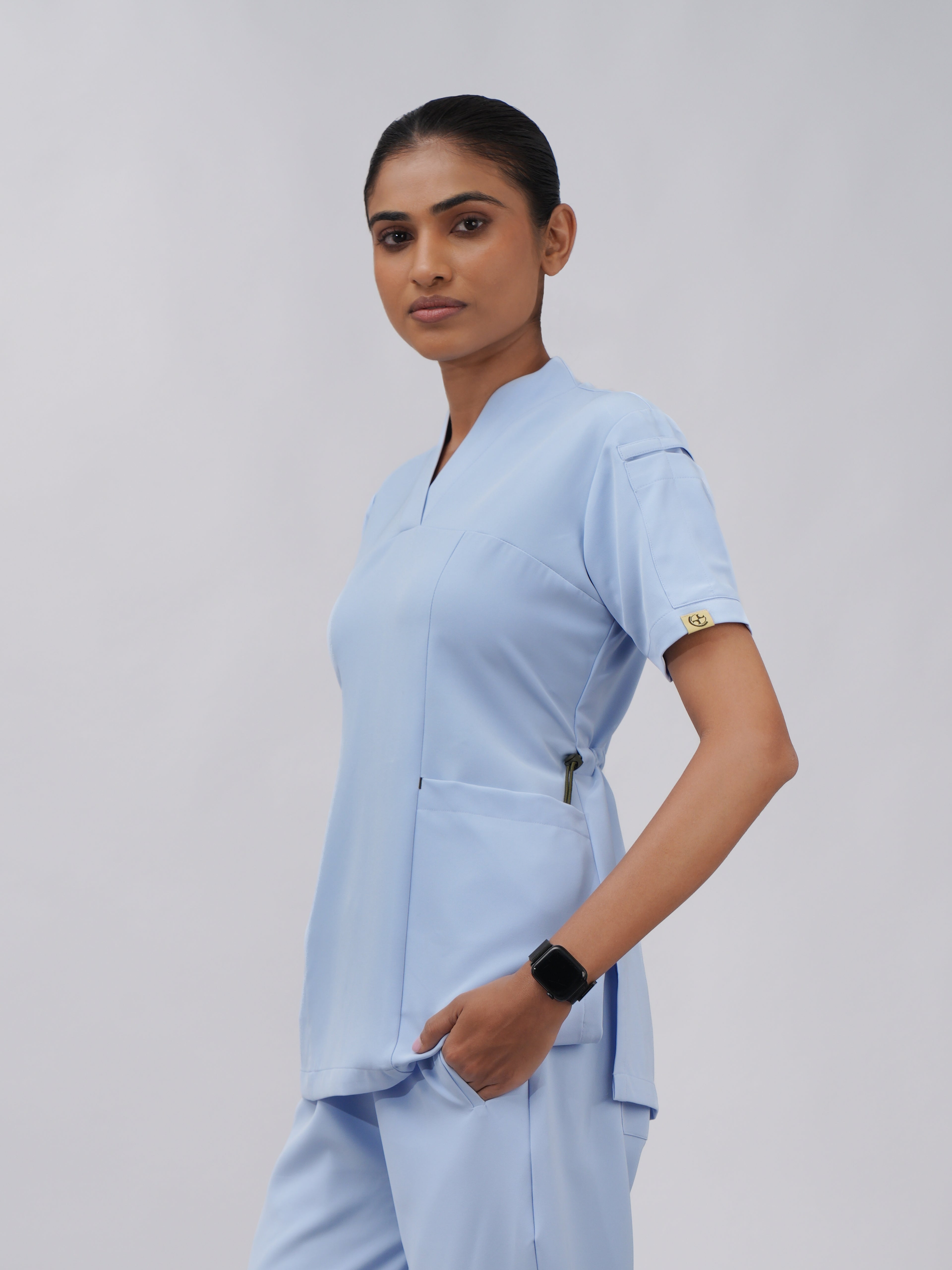 Sqwish premium scrub top for doctors - Soft Cloud - three-quarter side view